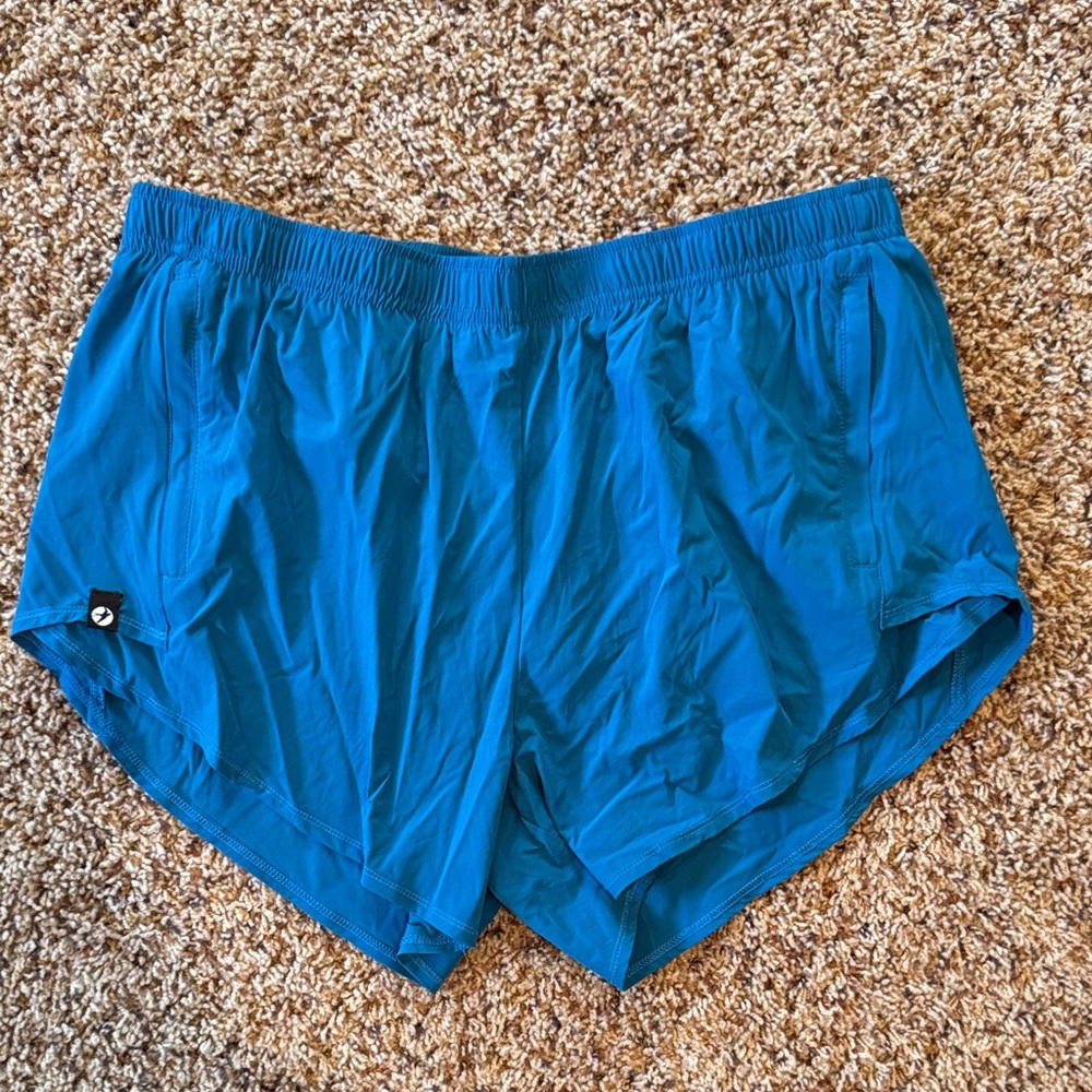 NWOT Oiselle “Pacific” Blue Flyout Shorts, 8